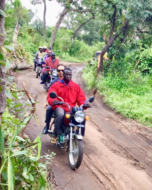  John McCauley with a village king and his entourage at one of the Benin project's work sites 
