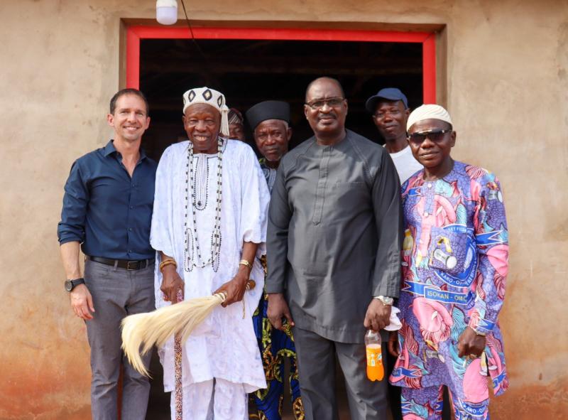John McCauley with a village king and his entourage at one of the Benin project's work sites