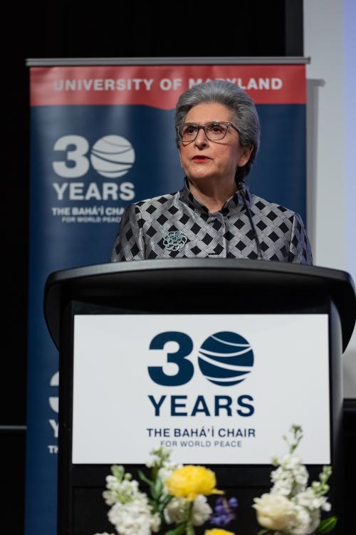 hoda mahmoudi speaking at 30th anniversary event