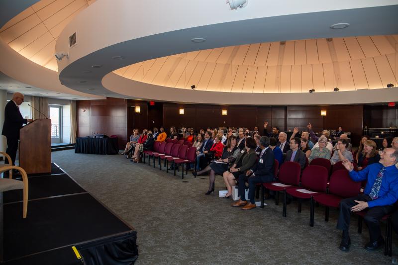 David M. Rubenstein speaking in the Ronald Reagan Building Rotunda