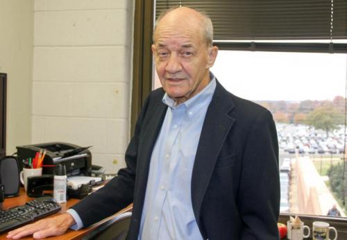 photo of John Pease, SOCY professor, in his office