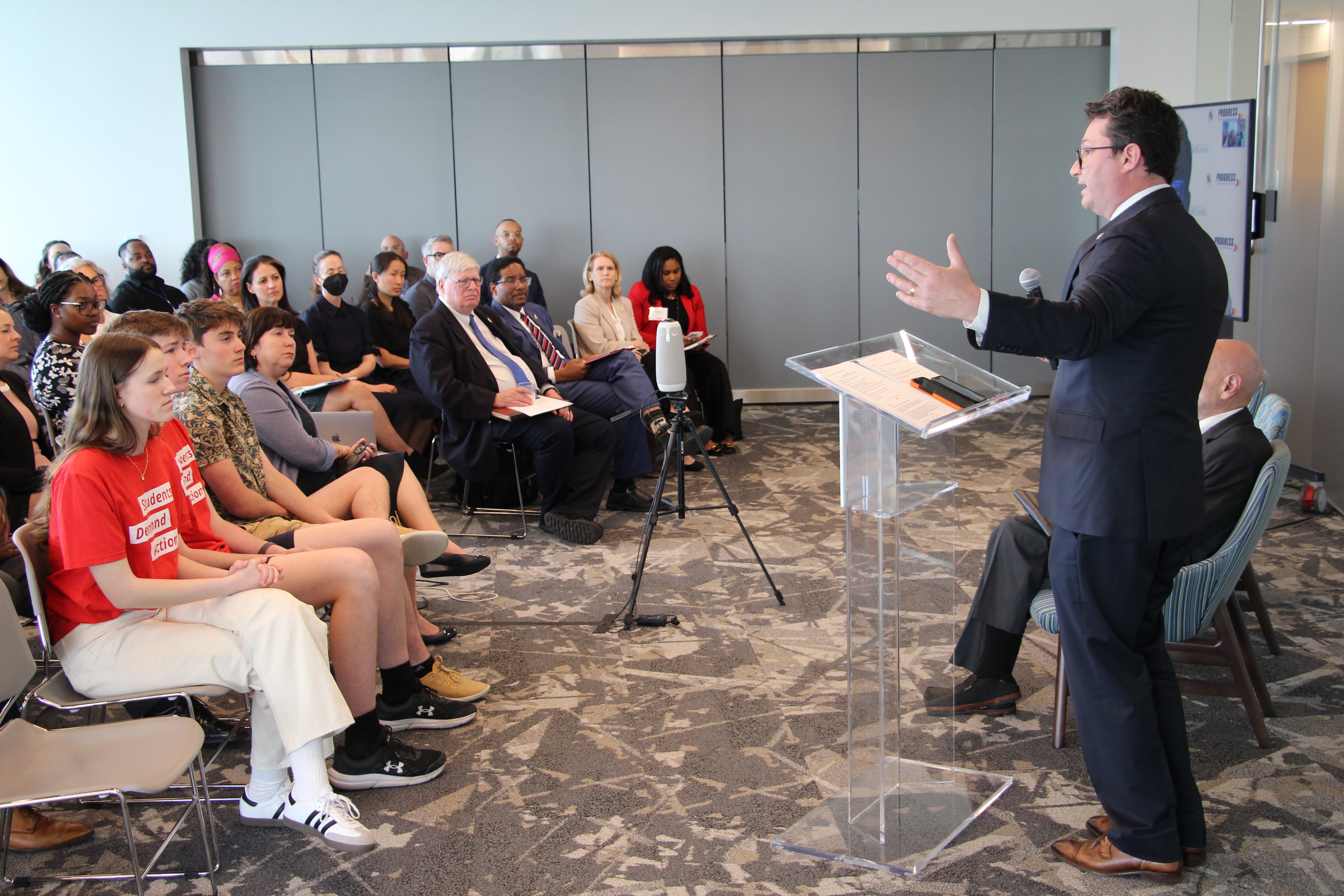 WHOGVP Deputy Director Rob Wilcox addresses the audience, including representatives of Students Demand Action (front row).