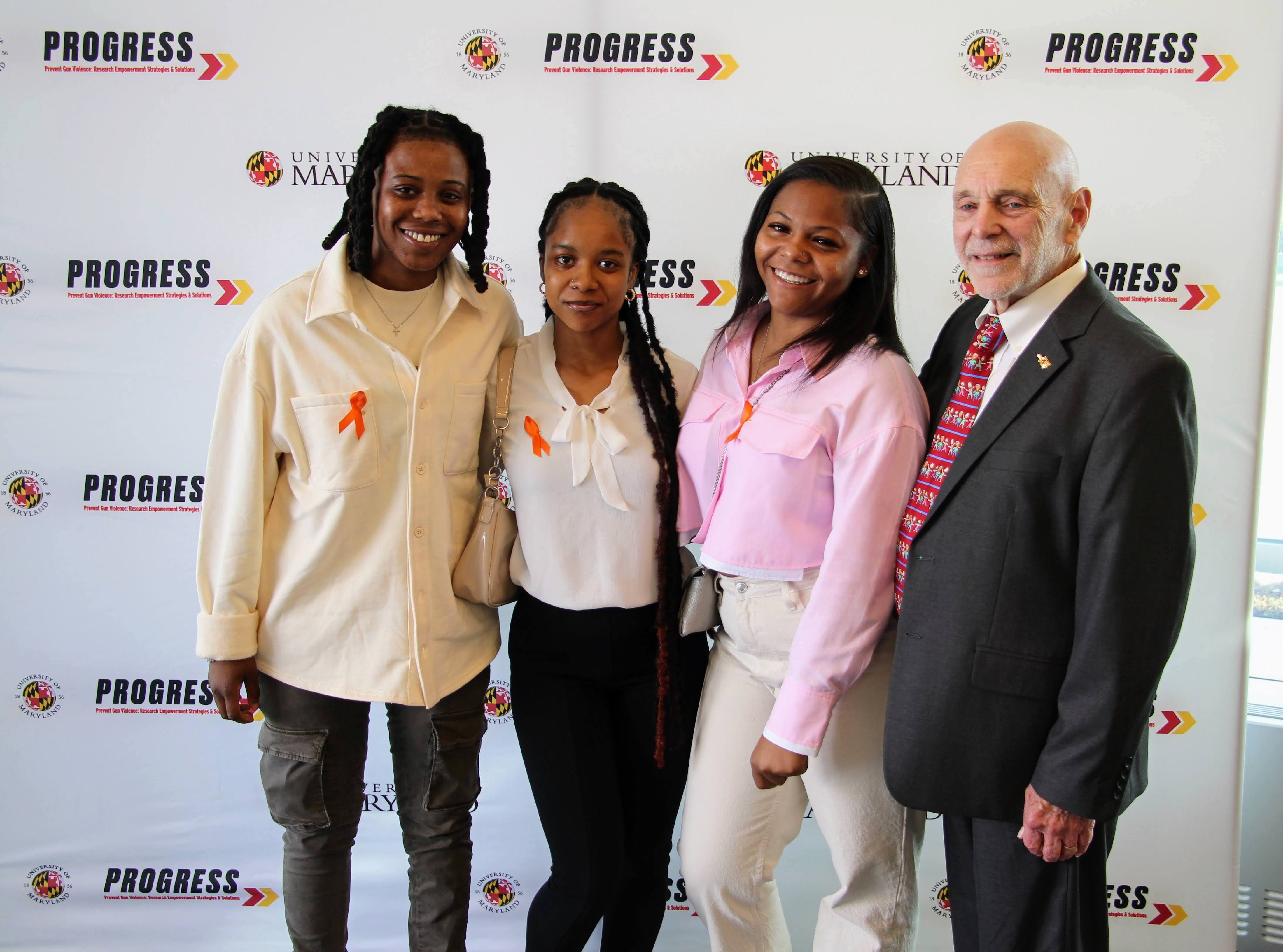 PROGRESS Co-Director Woodie Kessel pictured with gun violence survivors.