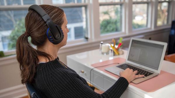 woman testing her hearing using visisonics