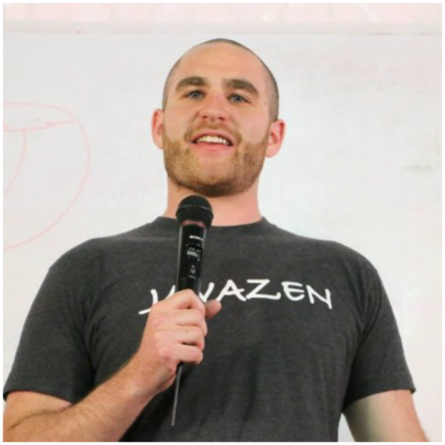 Eric Golman speaking into microphone