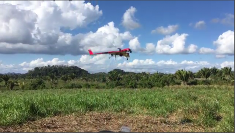 A FireFLY 6 drone prepares to aerially scan a Q'echi' Maya villiage in Belize.