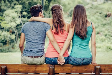 three people on a bench