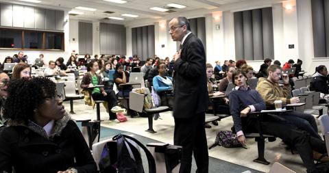 Class watching professor give lecture