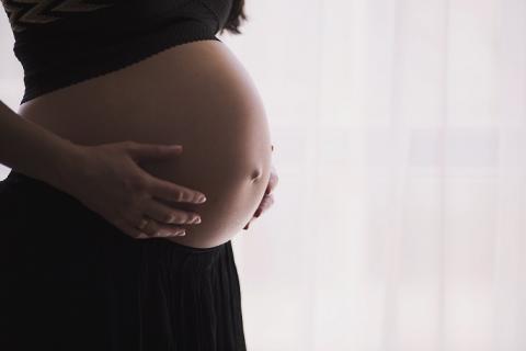 image of a woman's pregnant belly