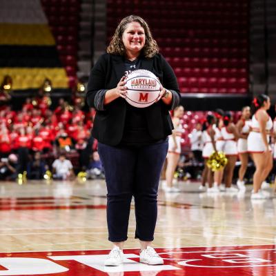 cortney fisher being recognized as guest coach of the game at the Maryland Women's Basketball game against Harvard